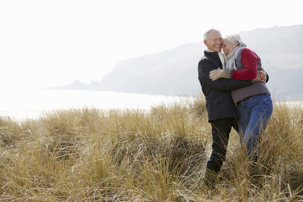 Elderly couple embracing